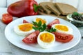 Boiled egg and fresh tomato, black bread - light diet breakfast. Royalty Free Stock Photo