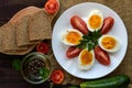 Boiled egg and fresh tomato, black bread - light diet breakfast. Royalty Free Stock Photo