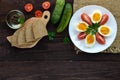 Boiled egg and fresh tomato, black bread - light diet breakfast. Royalty Free Stock Photo