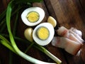 Boiled egg, green onions with bacon, parsley and garlic Royalty Free Stock Photo