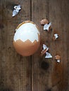 Boiled egg peeled on a wooden background