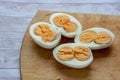 Boiled egg on wood background cutout