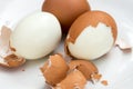 Boiled eggs on plate with broken eggshell Royalty Free Stock Photo