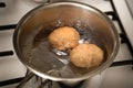 Boiled eggs in pot on the kitchen stove Royalty Free Stock Photo