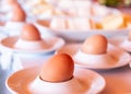 Boiled eggs served from white eggcups Royalty Free Stock Photo