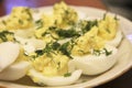 Boiled eggs sliced in halves stuffed and filling by pasta with d Royalty Free Stock Photo