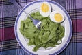 Boiled eggs with spinach pasta Royalty Free Stock Photo