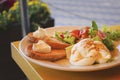 Boiled eggs with toasts, cheese mousse, vegetable salad on the table.