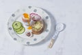 Boiled Eggs and Wholemeal Bread and Vegetables on White Rustic Royalty Free Stock Photo