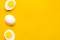 Boiled farm chicken eggs on yellow background Royalty Free Stock Photo