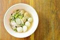 Boiled fish and shrimp ball topping slice pork in clear soup on bowl Royalty Free Stock Photo