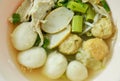 Boiled fish and shrimp ball topping slice pork in clear soup on bowl Royalty Free Stock Photo