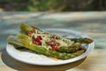 Boiled fresh green asparagus stalks with grated italian cheese. Royalty Free Stock Photo