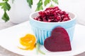 Boiled grated beet in a bowl and chiken egg