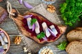 Boiled grated beets, pieces of herring, red onions, nuts on whole grain bread Royalty Free Stock Photo