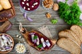 Boiled grated beets, pieces of herring, red onions, nuts on whole grain bread Royalty Free Stock Photo