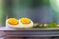 Boiled half egg are laid for decorate main dish on the wood table