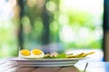 Boiled half egg are laid for decorate main dish on the wood table