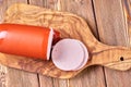 Boiled ham sausage sliced on a wooden kitchen board