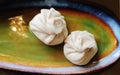 Boiled khinkali dumplings in a beautiful plate. Food in the restaurant .View from above.