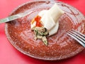 Boiled khinkali on a red table