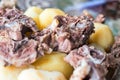 Boiled lamb meat and whole potatoes close up