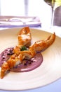 Boiled lobster with cranberry puree