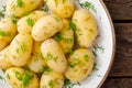Boiled new potato with butter, dill and green onion Royalty Free Stock Photo