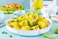 Boiled new potato with butter, dill and green onion Royalty Free Stock Photo