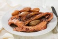 Boiled octopus with potato on plate Royalty Free Stock Photo
