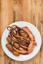 Boiled octopus with potato on white plate Royalty Free Stock Photo