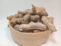 Boiled peanuts in a bamboo bowl on a white background Royalty Free Stock Photo