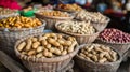 Boiled peanuts and snacks in market stall baskets. Royalty Free Stock Photo