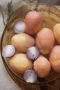 Boiled peeled potatoes and half red onion Royalty Free Stock Photo