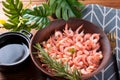 Boiled peeled shrimp with soy sauce on a plate. Royalty Free Stock Photo