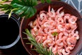 Boiled peeled shrimp with soy sauce on a plate. Royalty Free Stock Photo