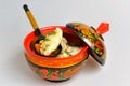 Boiled pelmeni in khokhloma painted russian wooden dishes with spoon