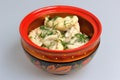 Boiled pelmeni in traditional painted russian wood