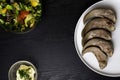 boiled pork and beef tongue and glass bowl with mayonnaise, vegetable salad Royalty Free Stock Photo