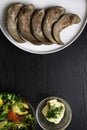 boiled pork and beef tongue and glass bowl with mayonnaise, vegetable salad Royalty Free Stock Photo