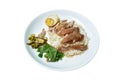 Boiled pork leg slice in black Chinese herb soup with egg dipping spicy and sour chili sauce topping rice on plate Royalty Free Stock Photo