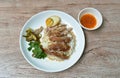 Boiled pork leg slice in black Chinese herb soup with egg dipping spicy and sour chili sauce topping rice on plate Royalty Free Stock Photo