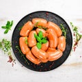 Boiled pork sausages with rosemary and spices. Royalty Free Stock Photo