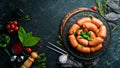 Boiled pork sausages with rosemary and spices. Royalty Free Stock Photo