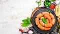 Boiled pork sausages with rosemary and spices. Royalty Free Stock Photo