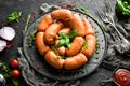 Boiled pork sausages with rosemary and spices. Royalty Free Stock Photo