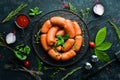 Boiled pork sausages with rosemary and spices. Royalty Free Stock Photo