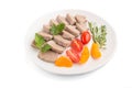 Boiled pork tongue with tomatoes and herbs isolated on white background. Side view, close up Royalty Free Stock Photo