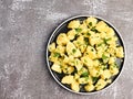 Boiled potatoes with parsley on a round plate on a dark background Royalty Free Stock Photo