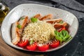 boiled ptitim Organic wheat pasta with chicken, cherry tomatoes and cheese, Food recipe background. Close up